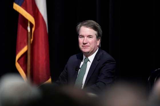 Brett Kavanaugh seated on stage in front of an audience