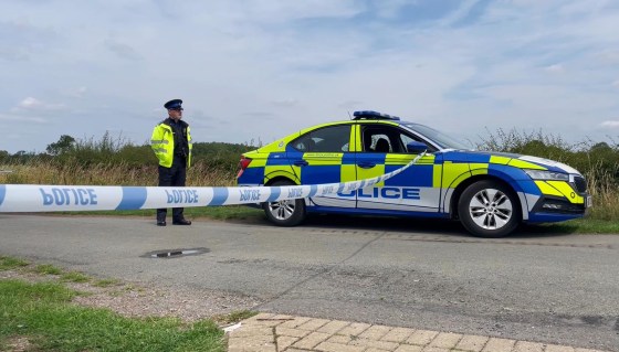 A police vehicle blocks the road in the village of Stathern