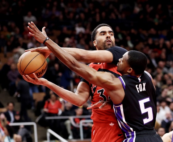 Jontay Porter of the Toronto Raptors battles De'Aaron Fox) of the Sacramento Kings on
March 20, 2024.