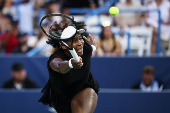 Venus Williams returns a shot