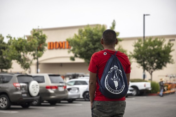 A day laborer waits in the parking lot of a Home Depot as federal immigration conducts raids in Los Angeles on June 20, 2025. 