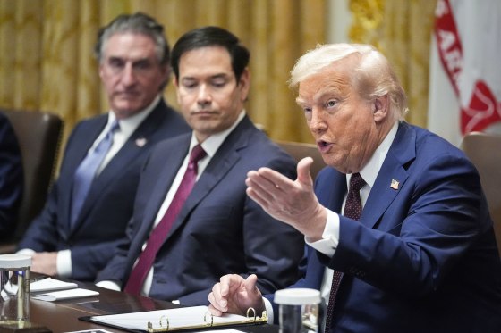 Donald Trump speaks, right, as Marco Rubio and Doug Burgum look on