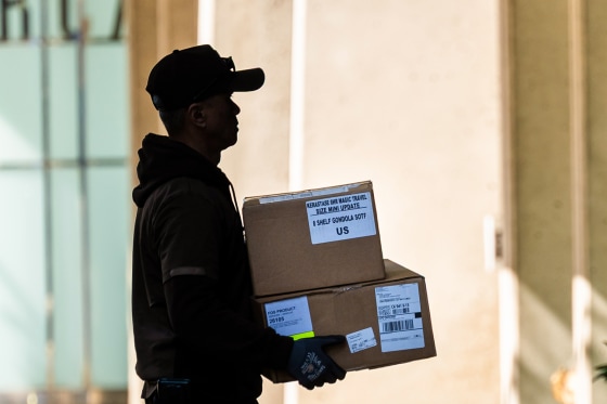 A UPS worker delivers packages in San Francisco on April 28, 2025.