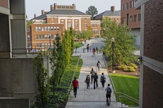Students walk on the campus at the University of Rochester in New York.