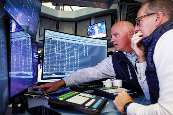 Traders work on the floor of the NYSE in New York