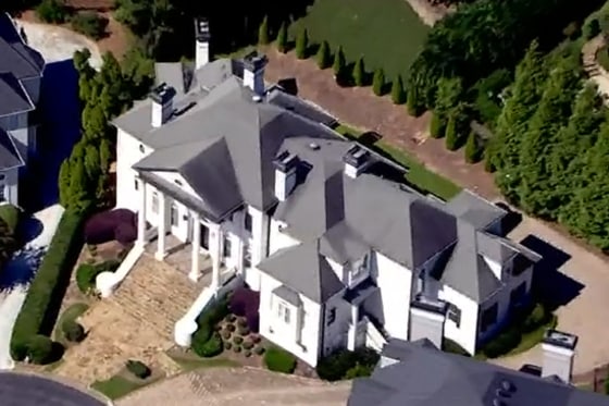 The home in Johns Creek, Ga., where police found a family of three dead during a welfare check.