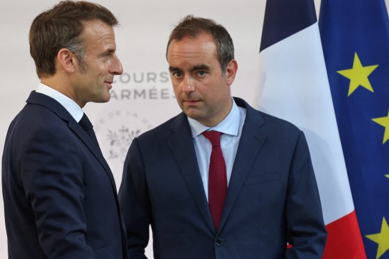 France's President Emmanuel Macron speaks with France's Minister of Armed Forces Sebastien Lecornu in Paris on July 13, 2025.