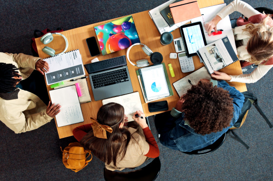 Above, study group and college with friends in library for research project, technology or legal stats. University, lawyer charts and case outcome probability with people on campus for digital course