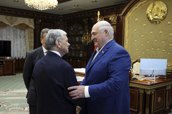 Belarusian President Alexander Lukashenko, right, and U.S. Presidential envoy John Coale