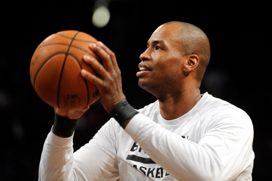 Jason Collins prepares to throw a basketball