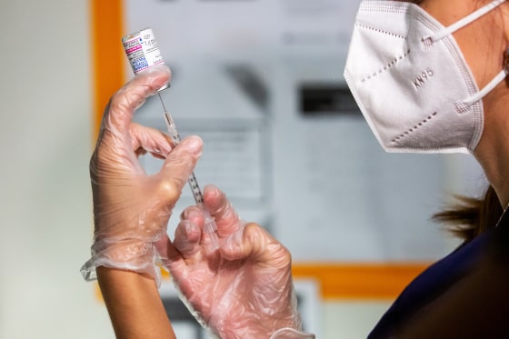 A healthcare worker prepares a dose of a Covid-19 vaccine