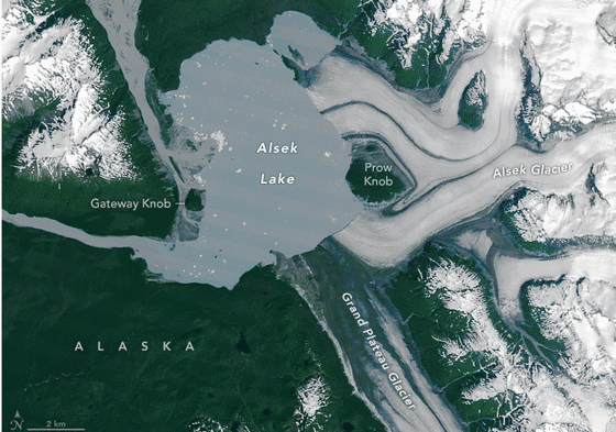 A landmass that was once encased in the ice of the Alsek Glacier is now surrounded by water.