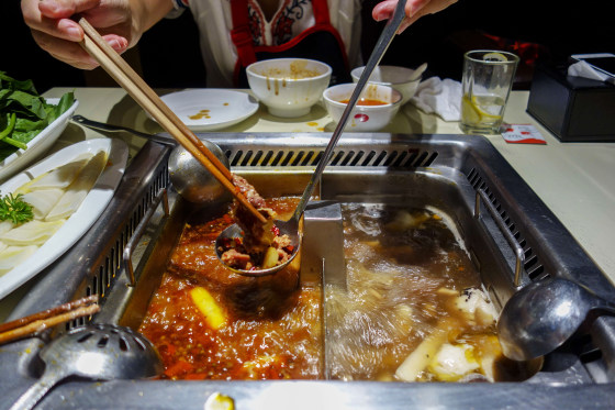 Spicy hotpot in a Hai Di Lao restaurant. Hai Di Lao Hot Pot