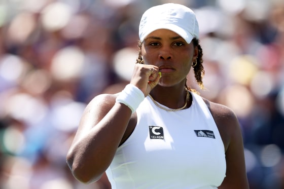 Taylor Townsend in a white cap, looking ahead.