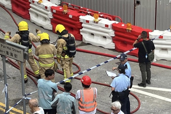 firefighters police officials hong kong WWII bomb