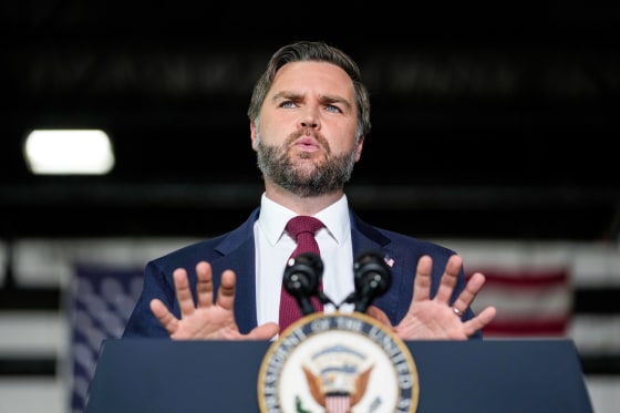 JD Vance speaks at a podium