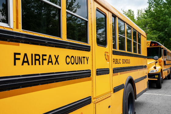 Fairfax County Public School buses idle at a middle school in Falls Church, Va.