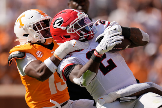 Tennessee linebacker Edwin Spillman (13) tackles Georgia running back Josh McCray (2) during the first half of an NCAA college football game Saturday, Sept. 13, 2025, in Knoxville, Tenn.