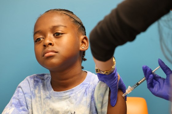 A child receives a COVID-19 vaccination in Culver City, Calif., on Sept. 23, 2025.