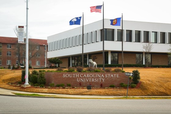 Exterior of South Carolina State University with sign and Bulldog statue