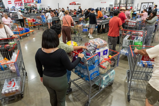 Shoppers wait to check out inside a Costco store
