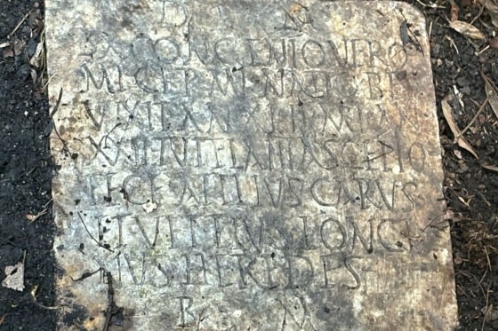 This photo provided by Tulane University classical archeologist Susann Lusnia shows a Latin inscription on the 1,900-year-old grave marker of a Roman sailor named Sextus Congenius Verus, discovered in a New Orleans backyard.