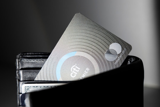 A Citi Mastercard credit card inside of a wallet peeking out
