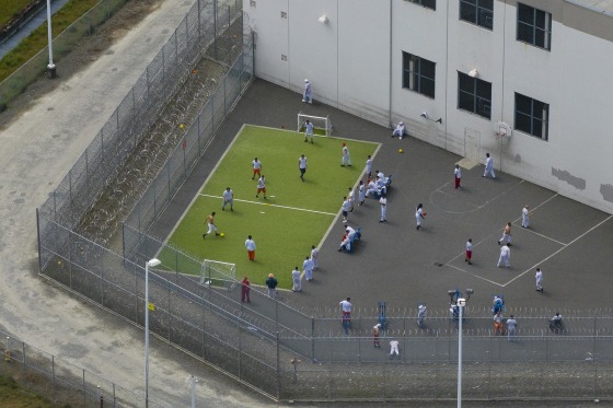 Detainees exercise in an outdoor recreation area at the Northwest ICE Processing Center on May 2, 2025 in Tacoma, Wash.