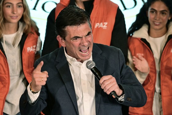 Bolivia's President-elect Rodrigo Paz celebrates with supporters in La Paz on October 19, 2025.