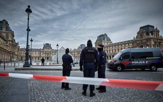 French Police officers seal off the entrance to the Louvre Museum after a Jewllery Heist.