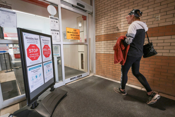 "Measles Alert" signs at the Taber Health Centre in Alberta on Oct. 27, 2025.