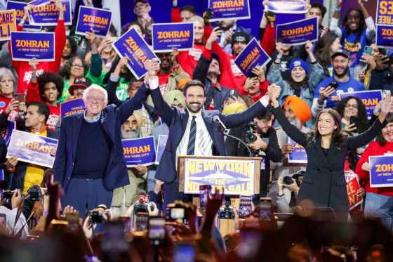 New York City mayoral candidate Zohran Mamdani holds hands with U.S. Senator Bernie Sanders and Rep. Alexandria Ocasio-Cortez.