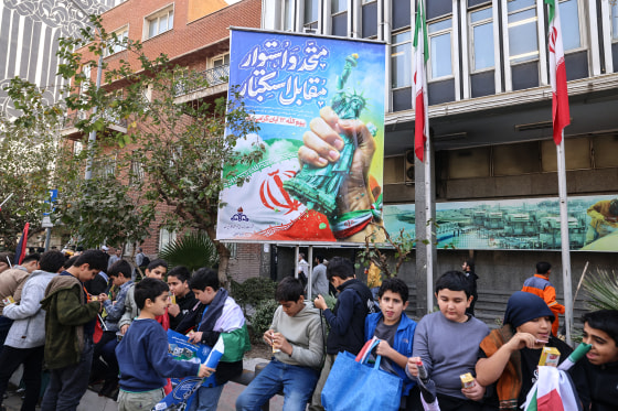 Image: People react during a rally outside the former U.S. embassy in Tehran