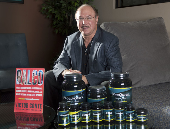 Victor Conte, owner of BALCO lab, sits behind a table of his supplements in Burlingame, Calif., in 2010.