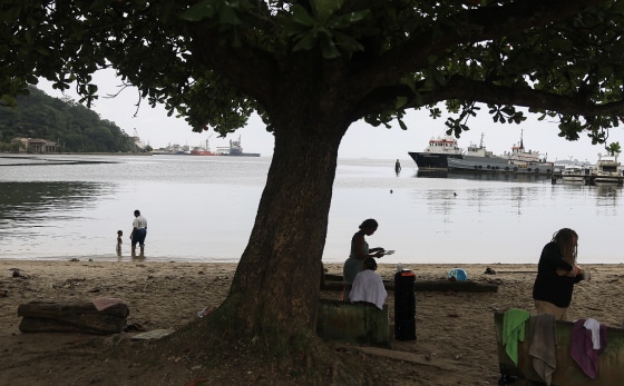 People along the Gulf of Paria in Port of Spain, Trinidad and Tobago.