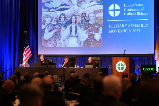 Rev. Michael J.K. Fuller, Archbishop Timothy Broglio and Archbishop William Lori of Baltimore conduct the United States Conference of Catholic Bishops plenary assembly in Baltimore, Md. on Tuesday.