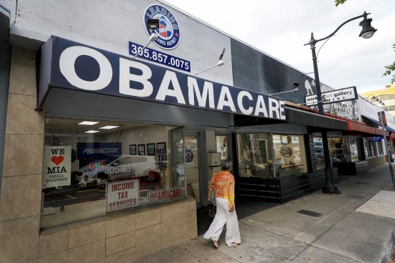 An Obamacare sign is displayed outside an insurance agency