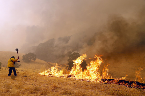 Benicia Fire Department firefighter Kyle Williams keep flames at bay.