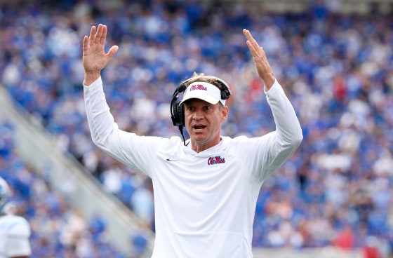 Lane Kiffin the head coach of Ole Miss Rebels with his hands in the air during a game.