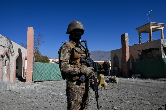 Image: A Pakistani military troop guards outside the damaged entrance