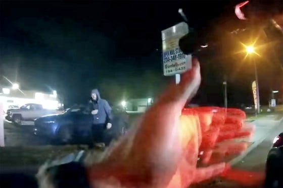 A police officer aims a gun at an unarmed man in Akron, Ohio, on Nov. 11 in bodycam video released by the mayor's office.