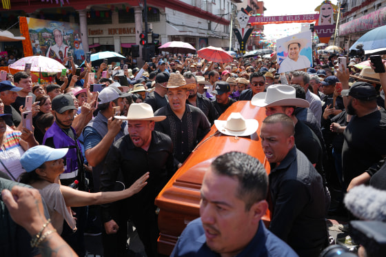 People carry the coffin of late Mayor Carlos Alberto Manzo Rodríguez, who was shot during Day of the Dead celebrations, in Uruapan, Michoacan state, Mexico on Nov. 2