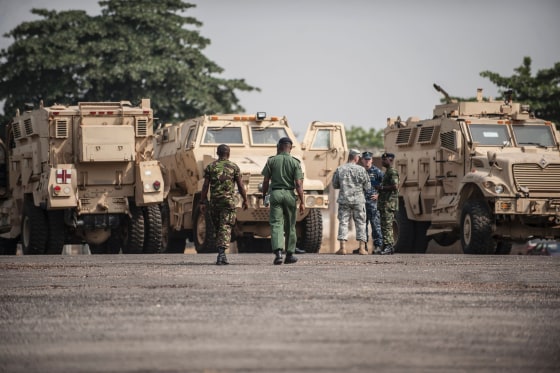 Members of the Nigerian and U.S. militaries next to some of the 24 armored vehicles donated to the Nigerian government in January 2016.