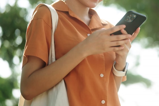 Teenage girl using smartphone.