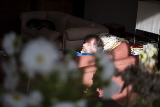 Man relaxing on sofa in the living room