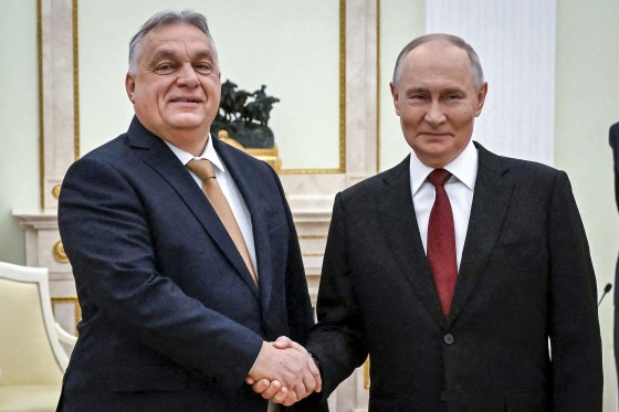 Russia's President Vladimir Putin and Hungary's Prime Minister Viktor Orban shake hands.