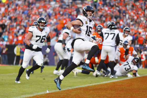 Trevor Lawrence of the Jacksonville Jaguars runs for a third-quarter touchdown against the Denver Broncos. 