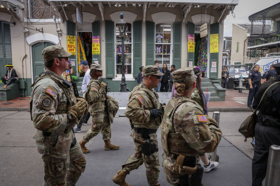 National Guardsmen patrol along Bourbon Street on Mardi Gras day in New Orleans, Louisiana