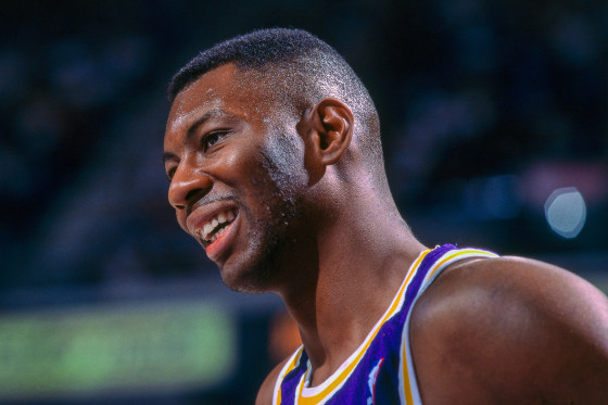 Elden Campbell of the Los Angeles Lakers smiles on the court.