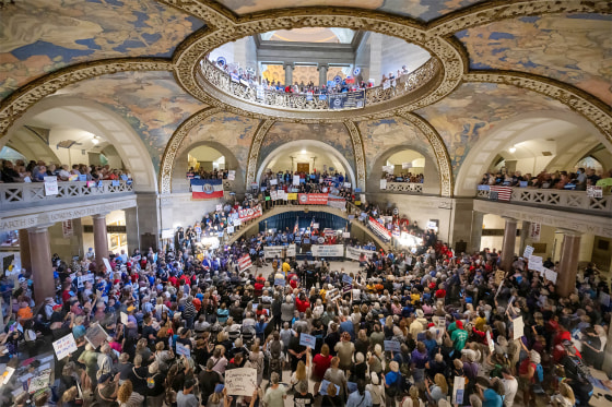 People gather at the Missouri statehouse in Jefferson City to protest redistricting